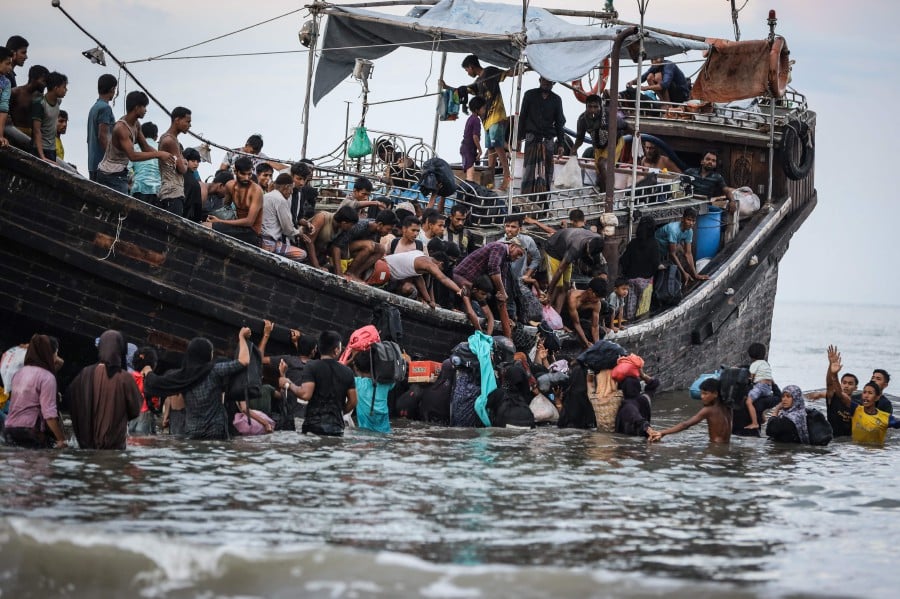 Indonesian navy pushes back Rohingya refugee boat off Aceh